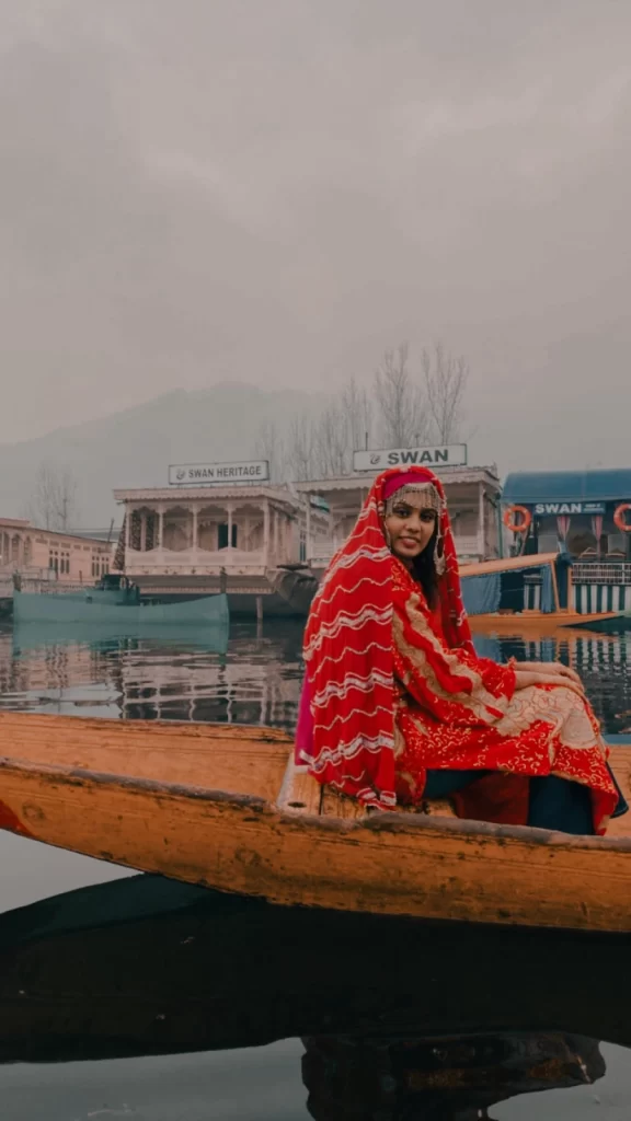 A lady sitting on a Houseboat in Kashmir